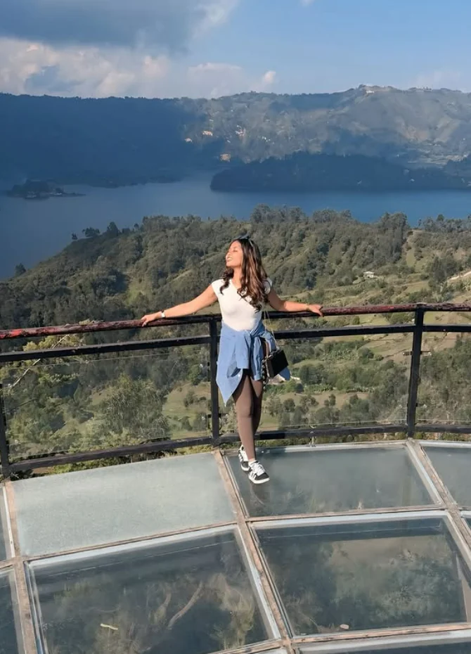 Efratah standing on the Wenchi overlook above the crater lake